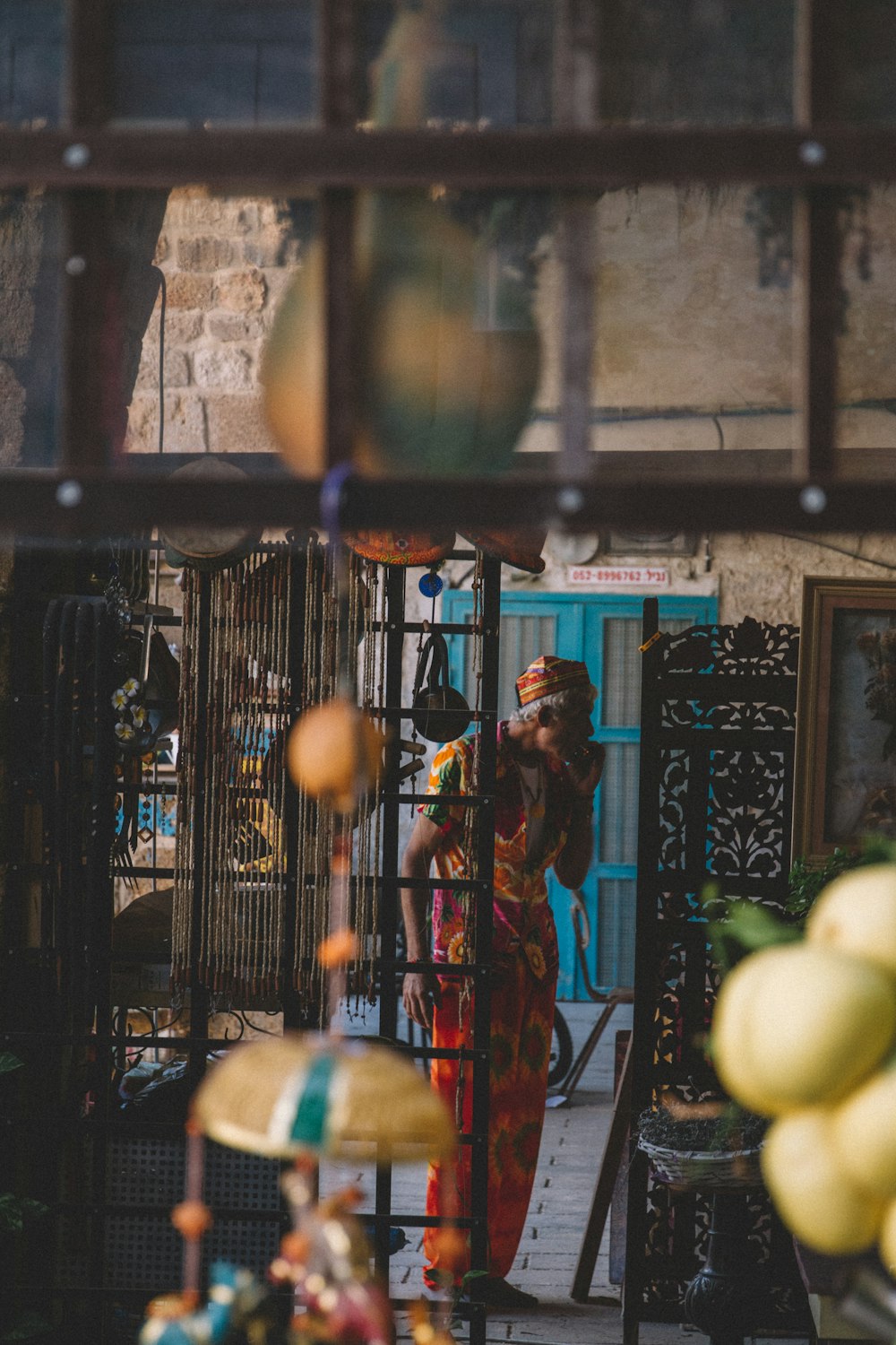 a woman standing in a doorway of a building