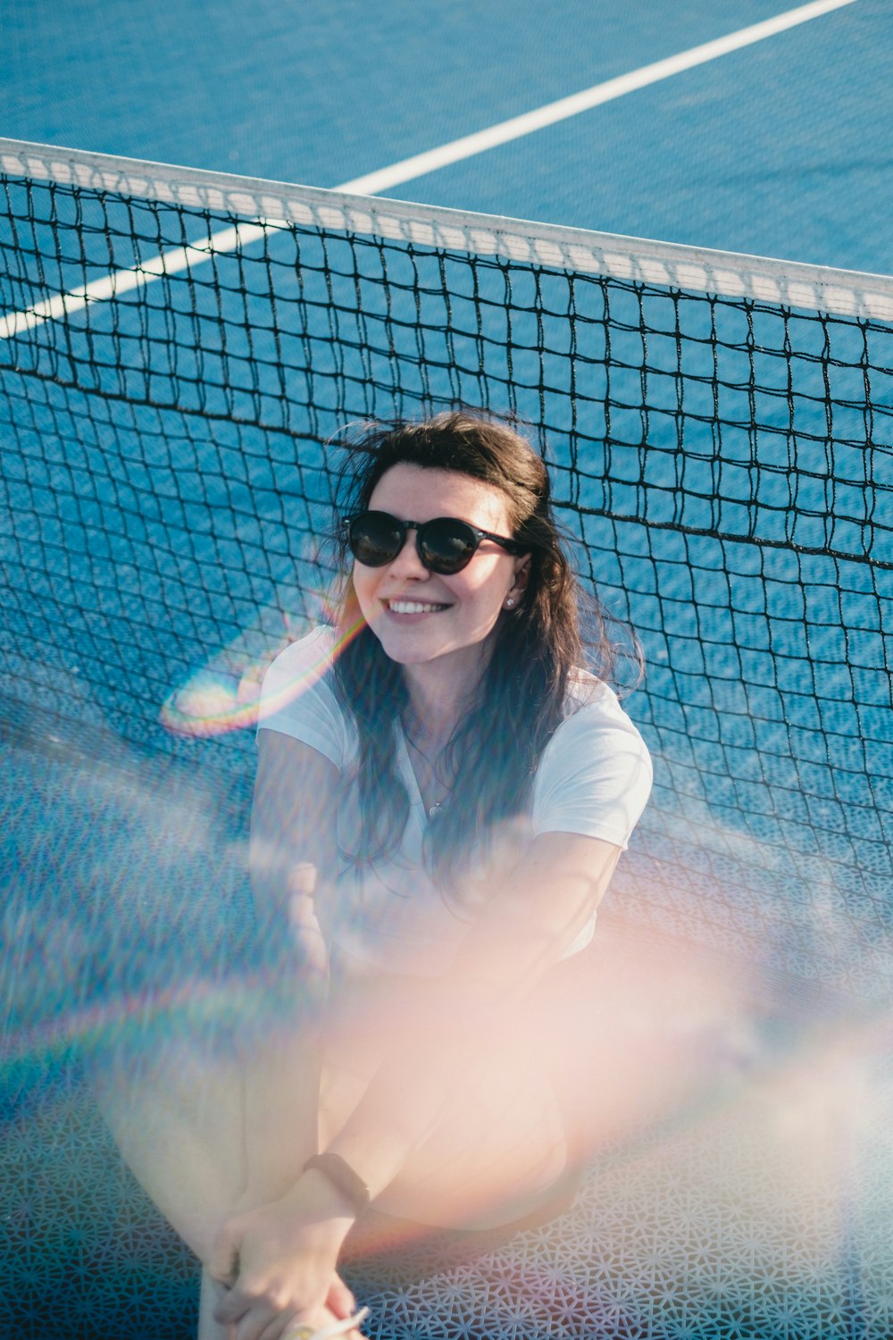 woman wears black frame sunglasses