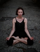 Close-up of a student focusing deeply while controlling their breath during meditation.