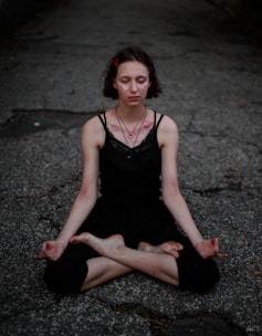 Close-up of a person meditating with a calm, determined expression.