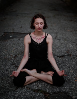 Close-up of a student focusing deeply while controlling their breath during meditation.