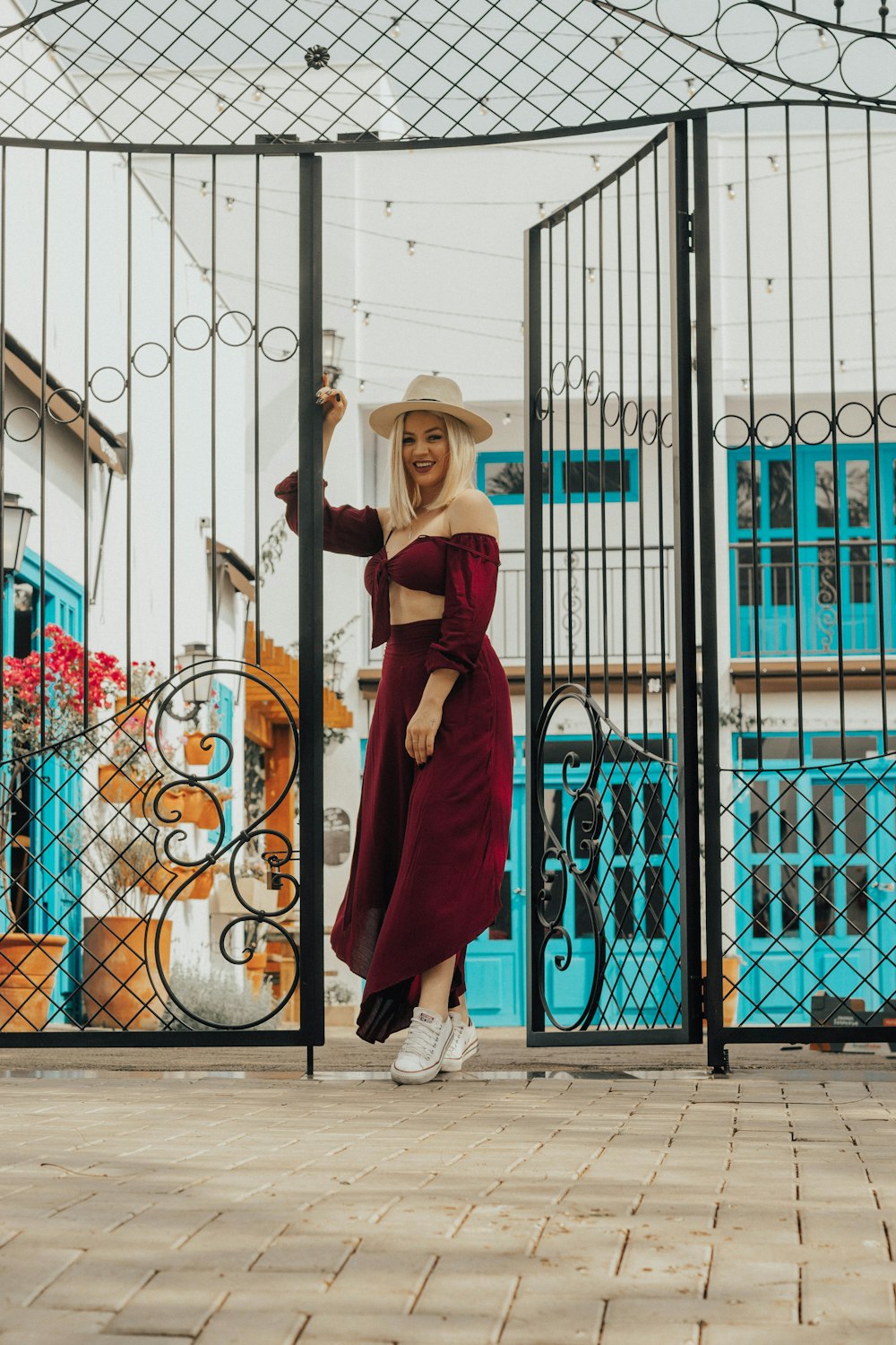 woman standing by an open gate