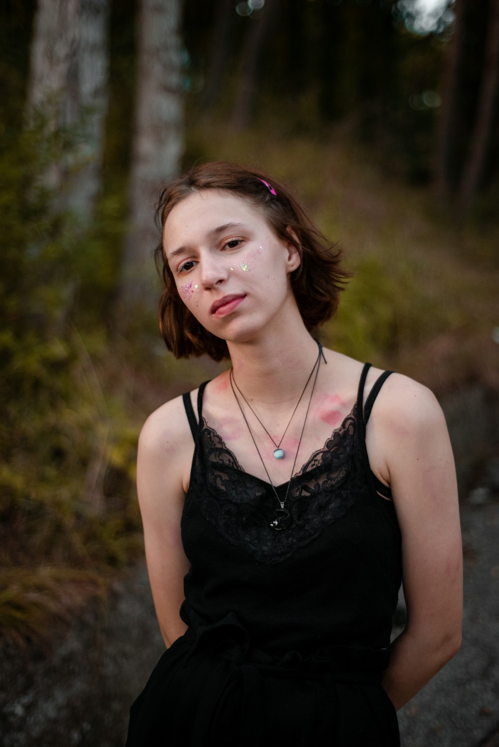 woman wearing black spaghetti strap lace tank top