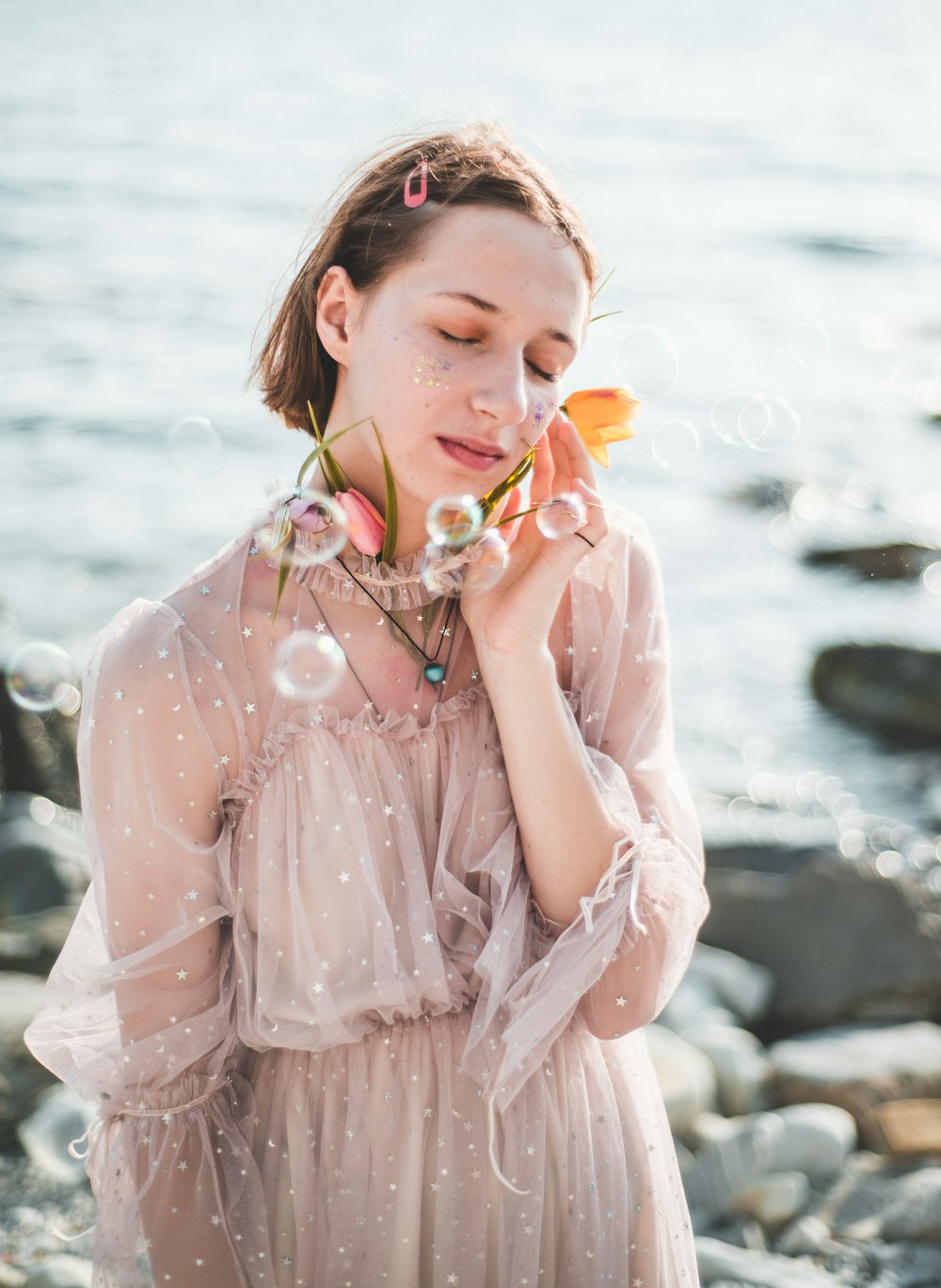 bubbles floating in front of a woman