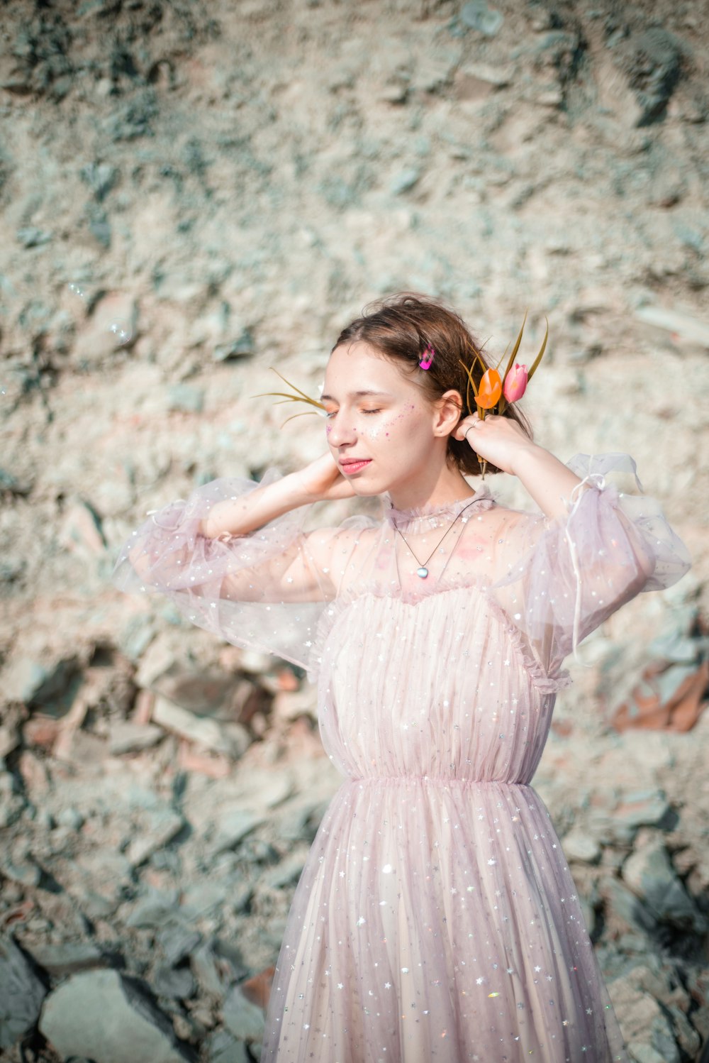 woman holding her hair wearing white lace pleated maxi dress