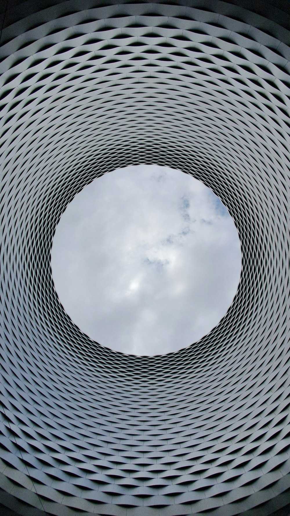 a circular object with a sky in the background