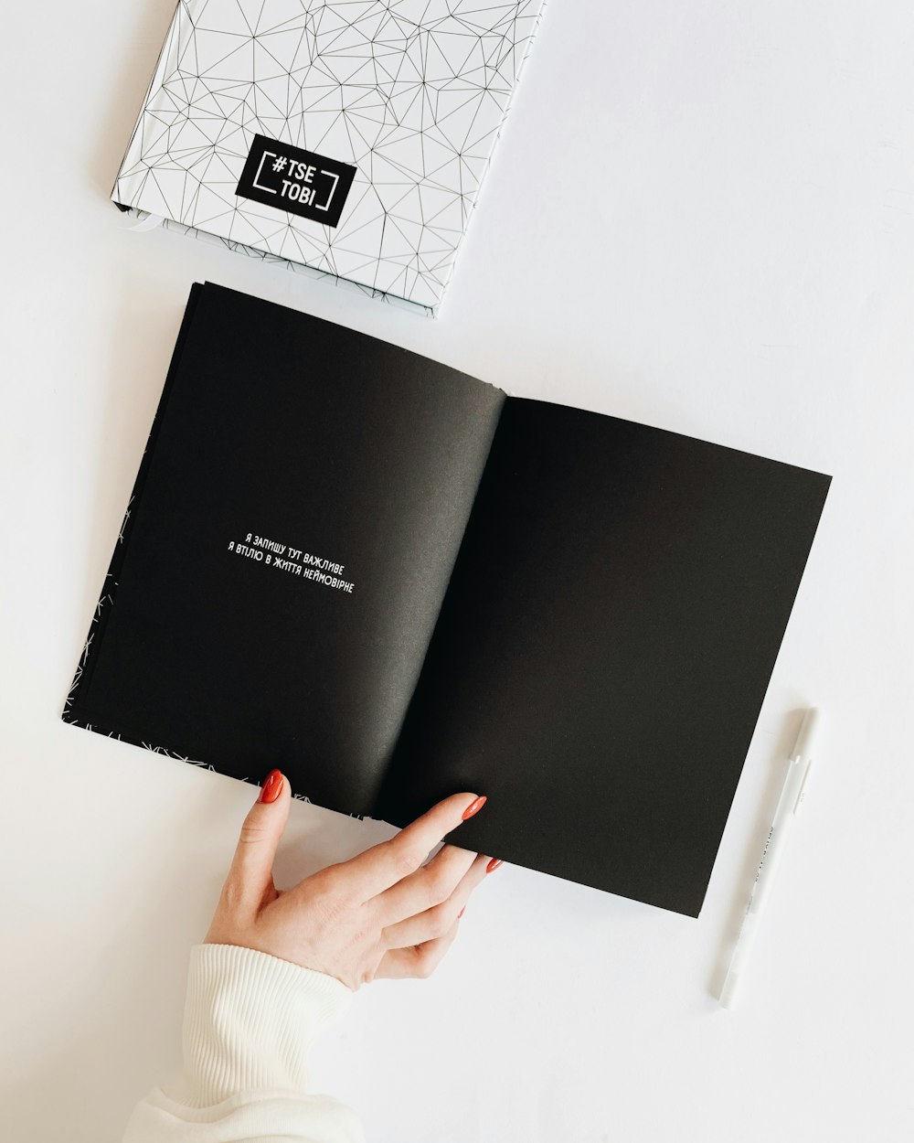 black book on white surface