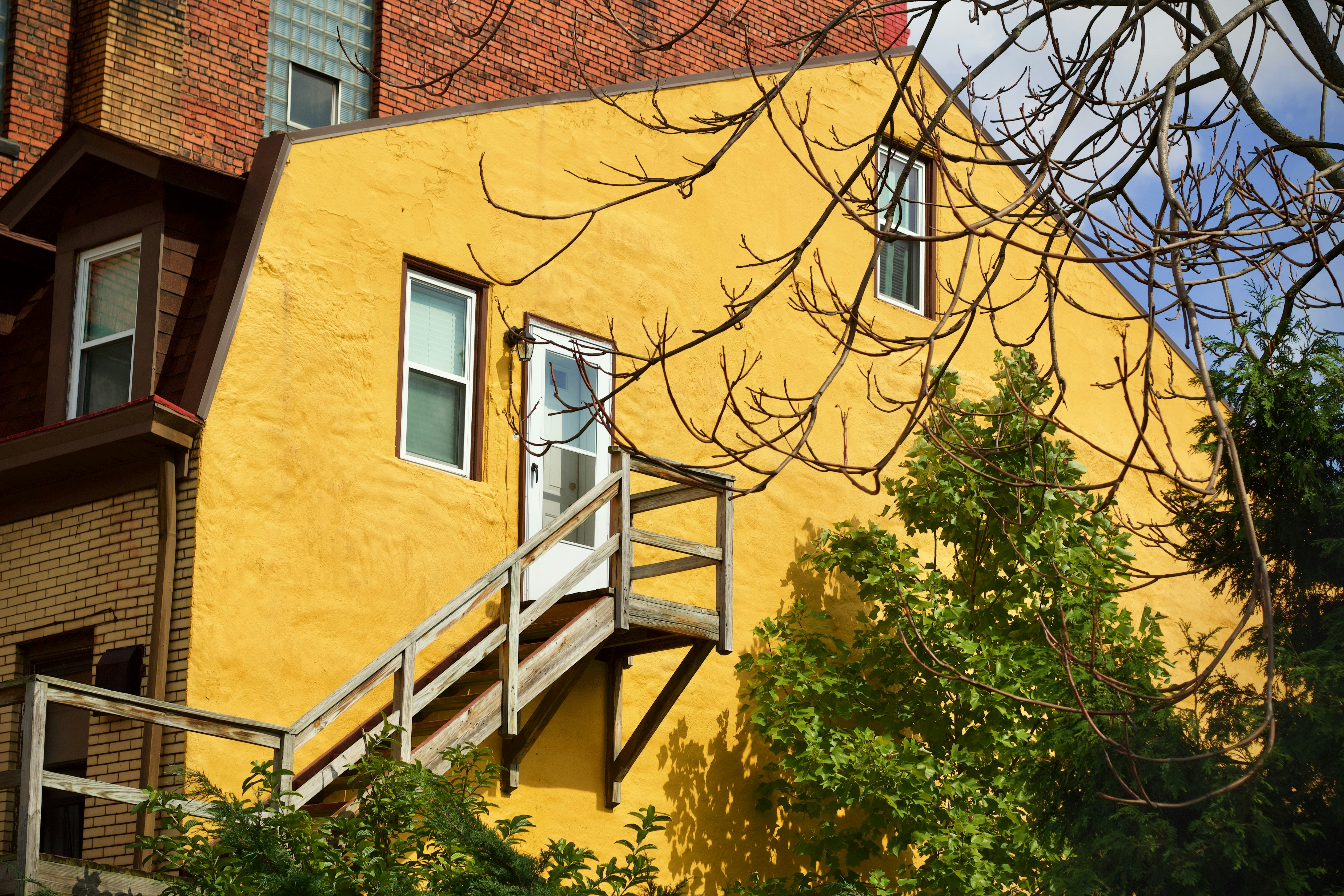 yellow concrete house during daytime, 