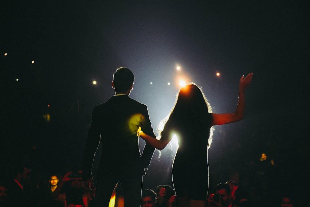 man and woman on stage