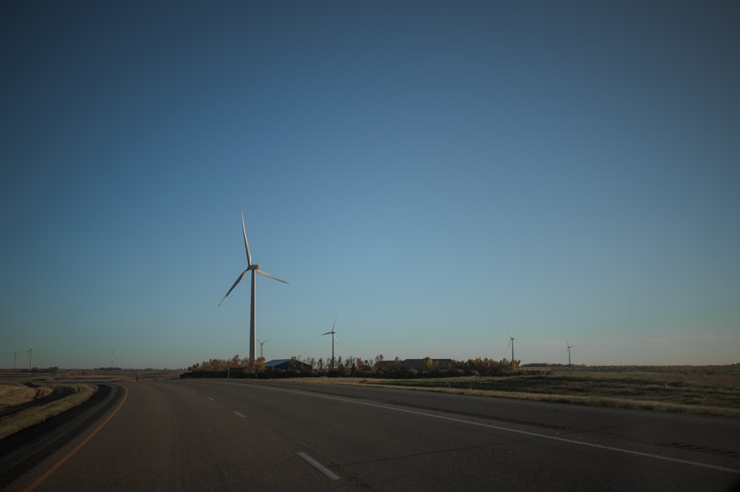 wind mills along side of concrete road