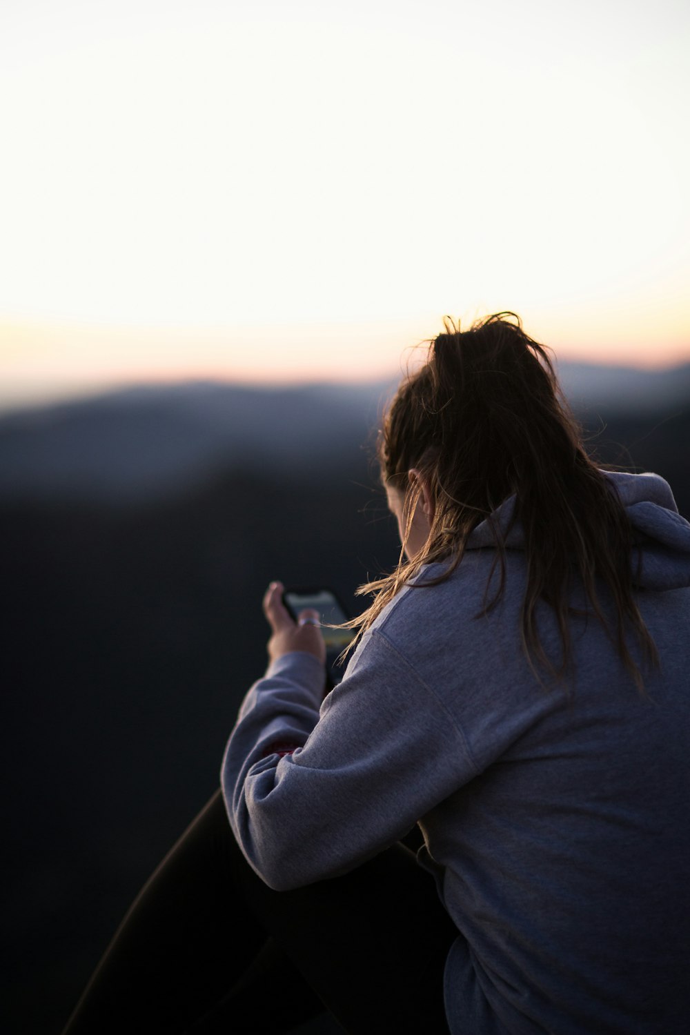 woman looking at phone