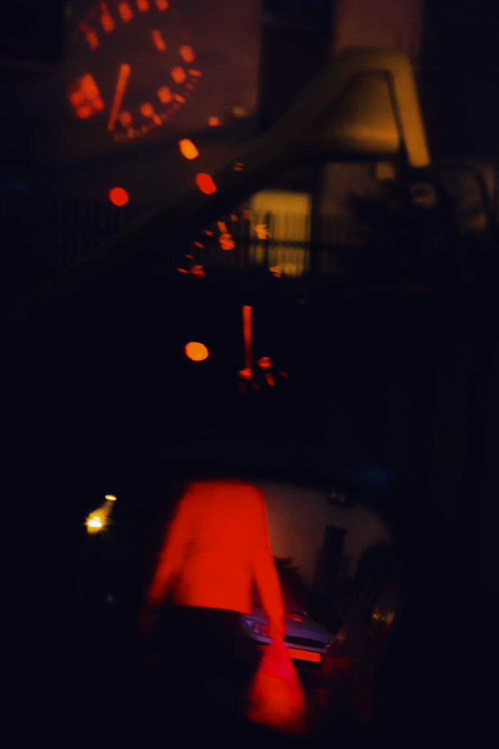 a blurry photo of a person in a car at night