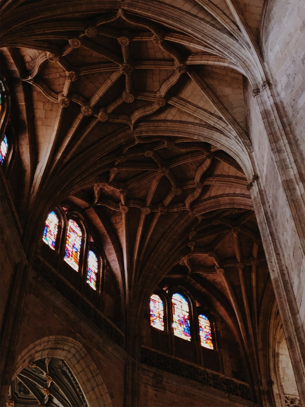 low-angle photography of brown concrete building interior