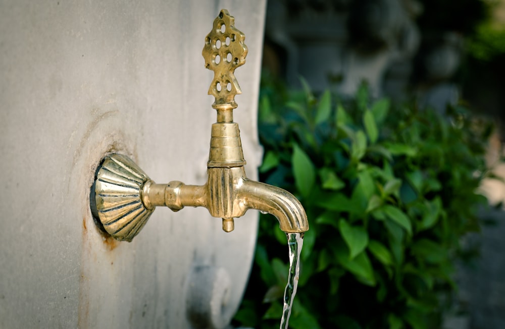 gold-colored faucet