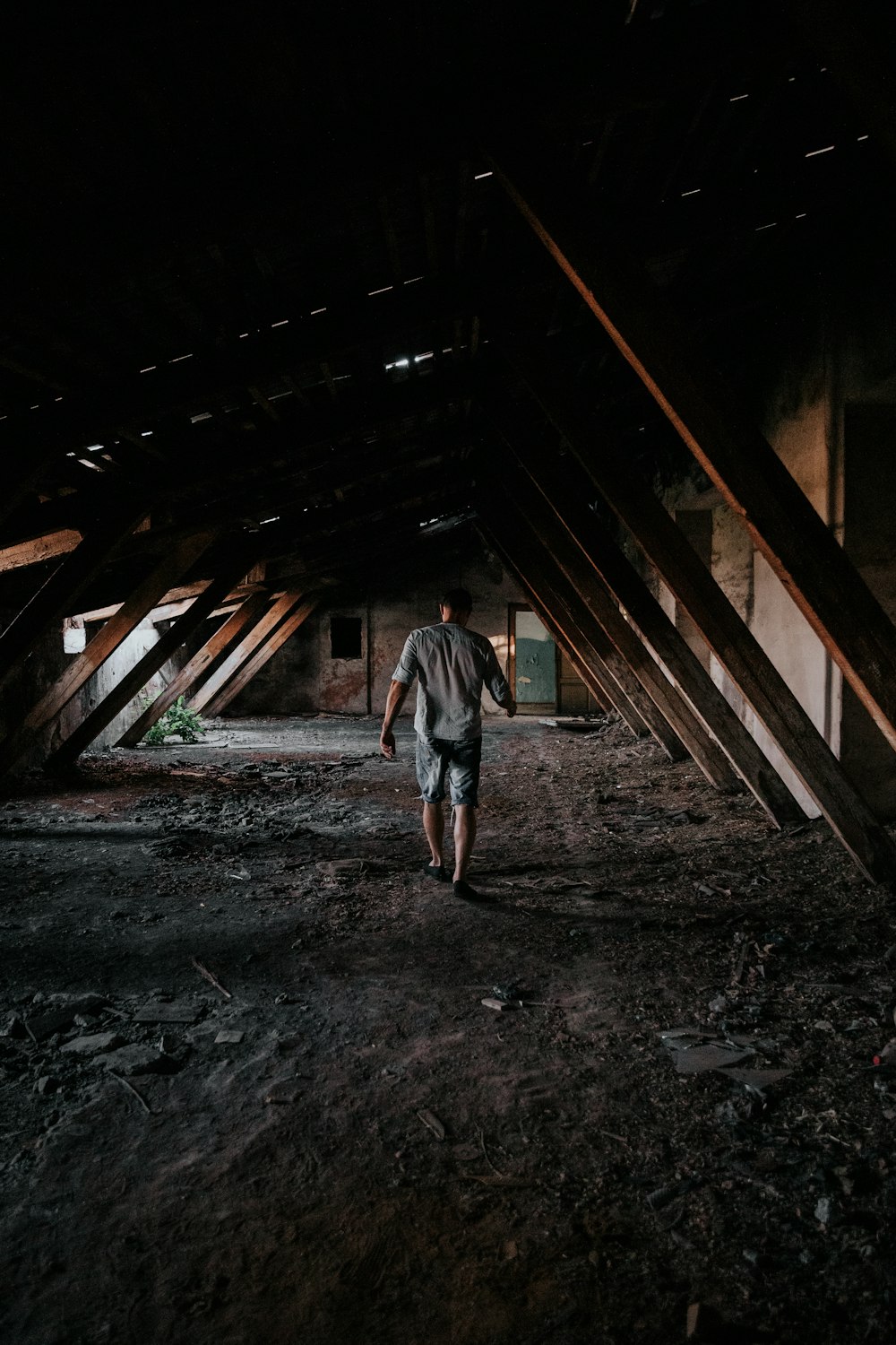 man walking between wall