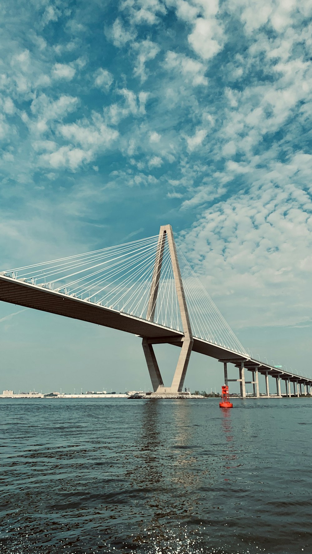 gray concrete bridge under white clouds