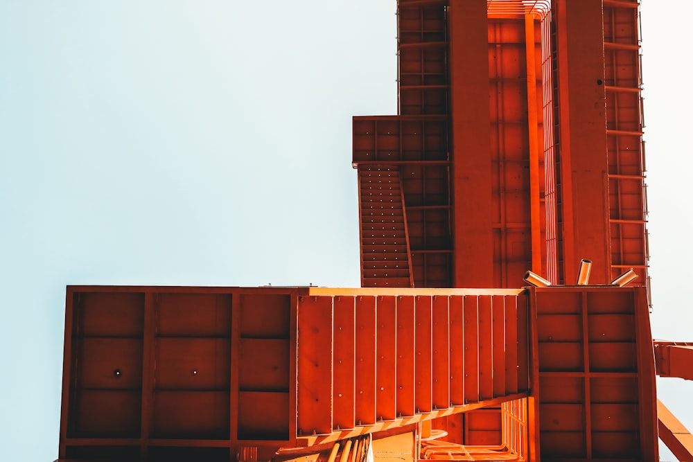 low angle photo of orange cargo containers