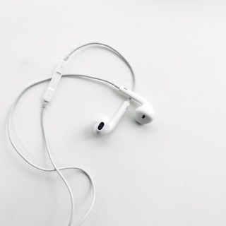 High-quality earphones with tangle-free cables displayed on a clean white surface.