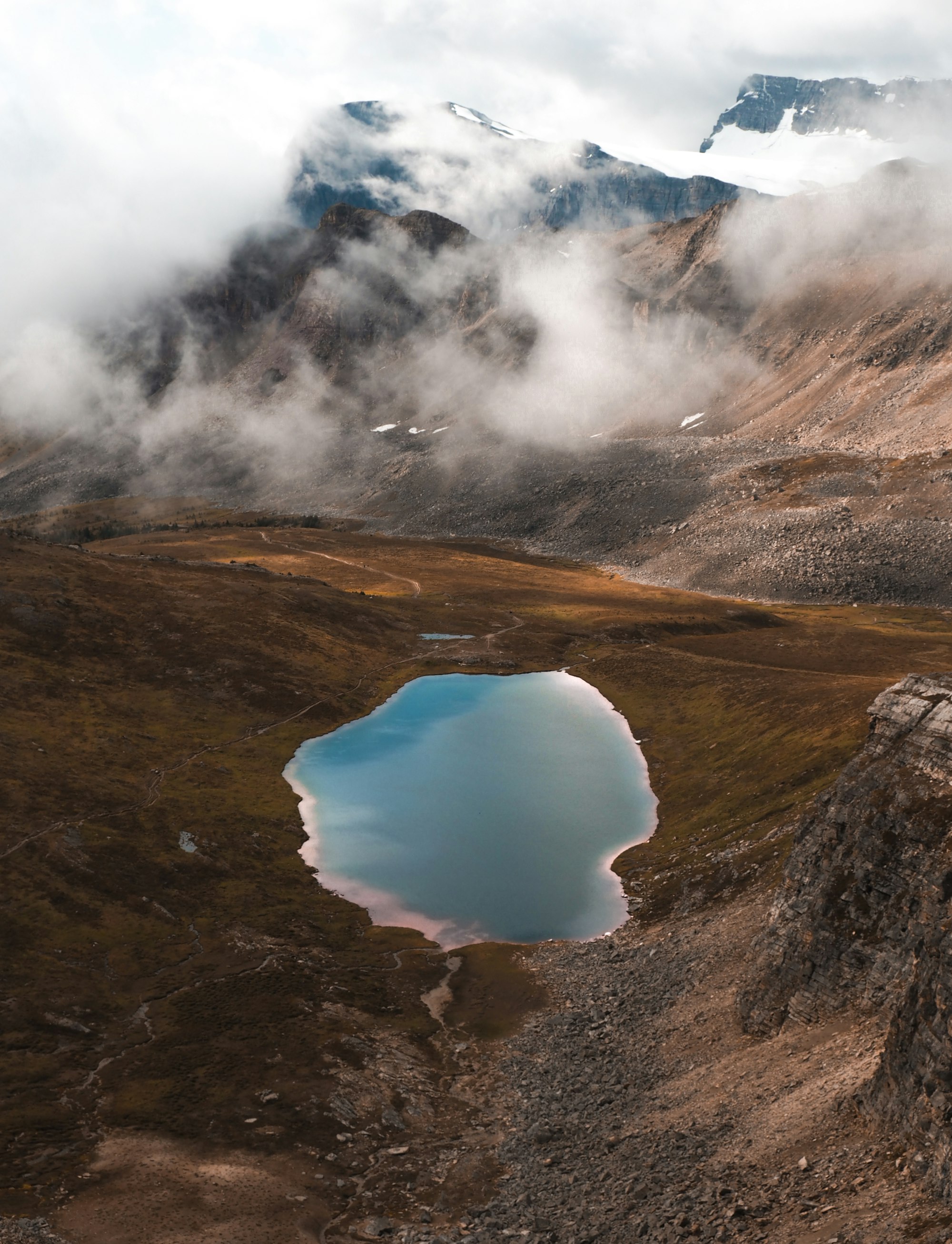 Morning mist beginning to clear up over the glowing Helen Lake in Banff National Park, Alberta, Canada. 