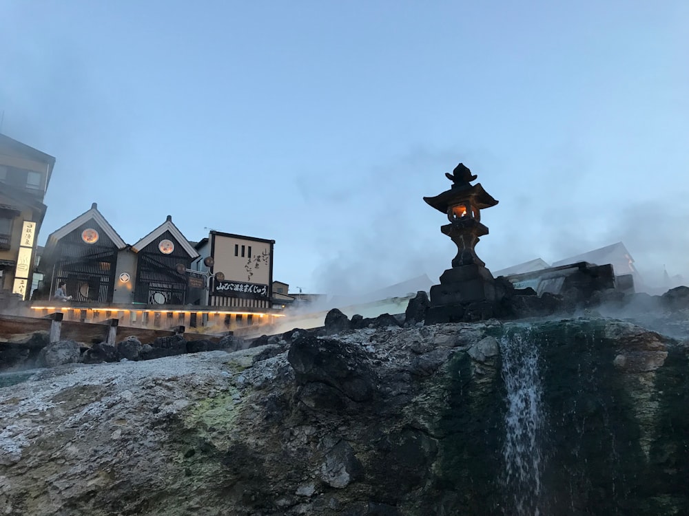 a large building with a fountain in front of it