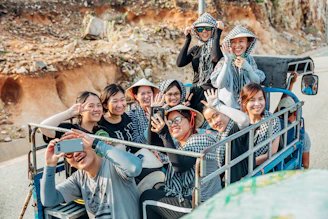 A group of corporate travelers smiling during a team-building excursion