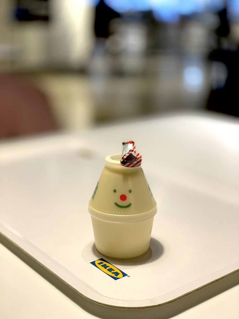 white plastic cone toy on white IKEA tray