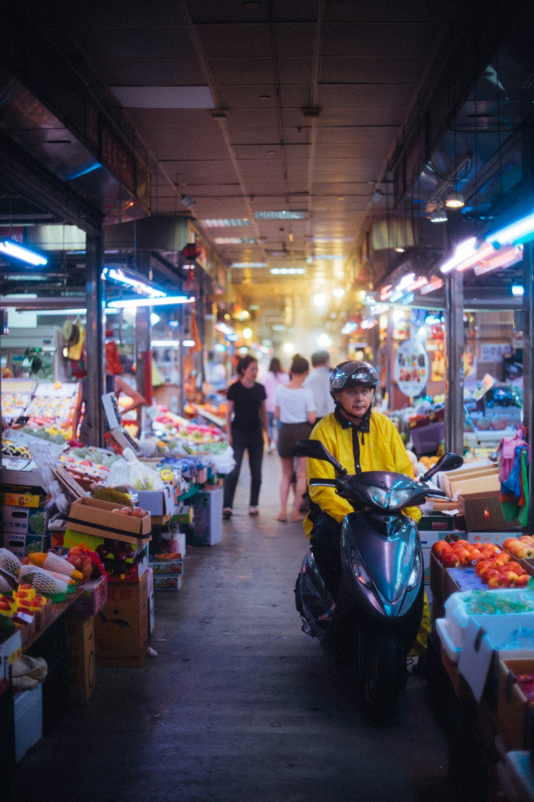 person riding on grey motor scooter