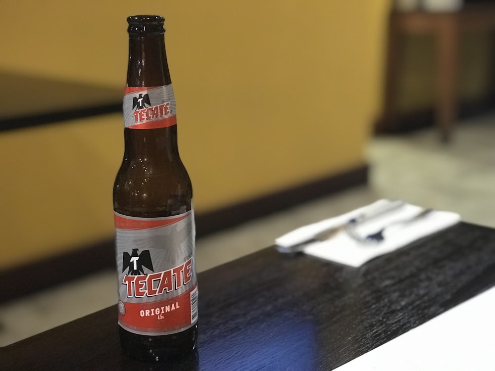 Tecate beer bottle on coffee table