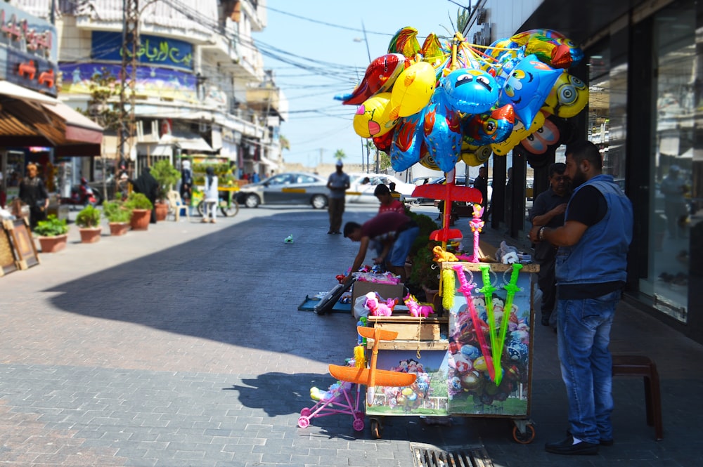 man vending toys on street