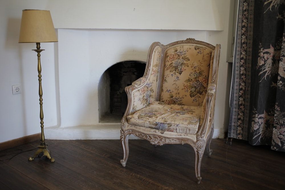 brown and multicolored floral wingback chair