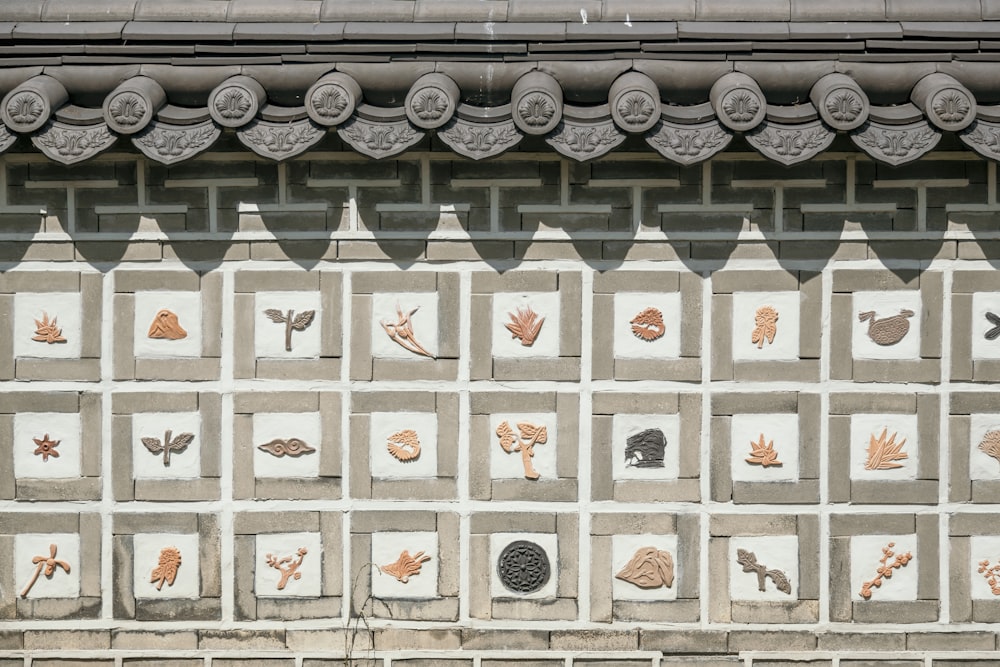 a close up of a wall with a decorative design on it