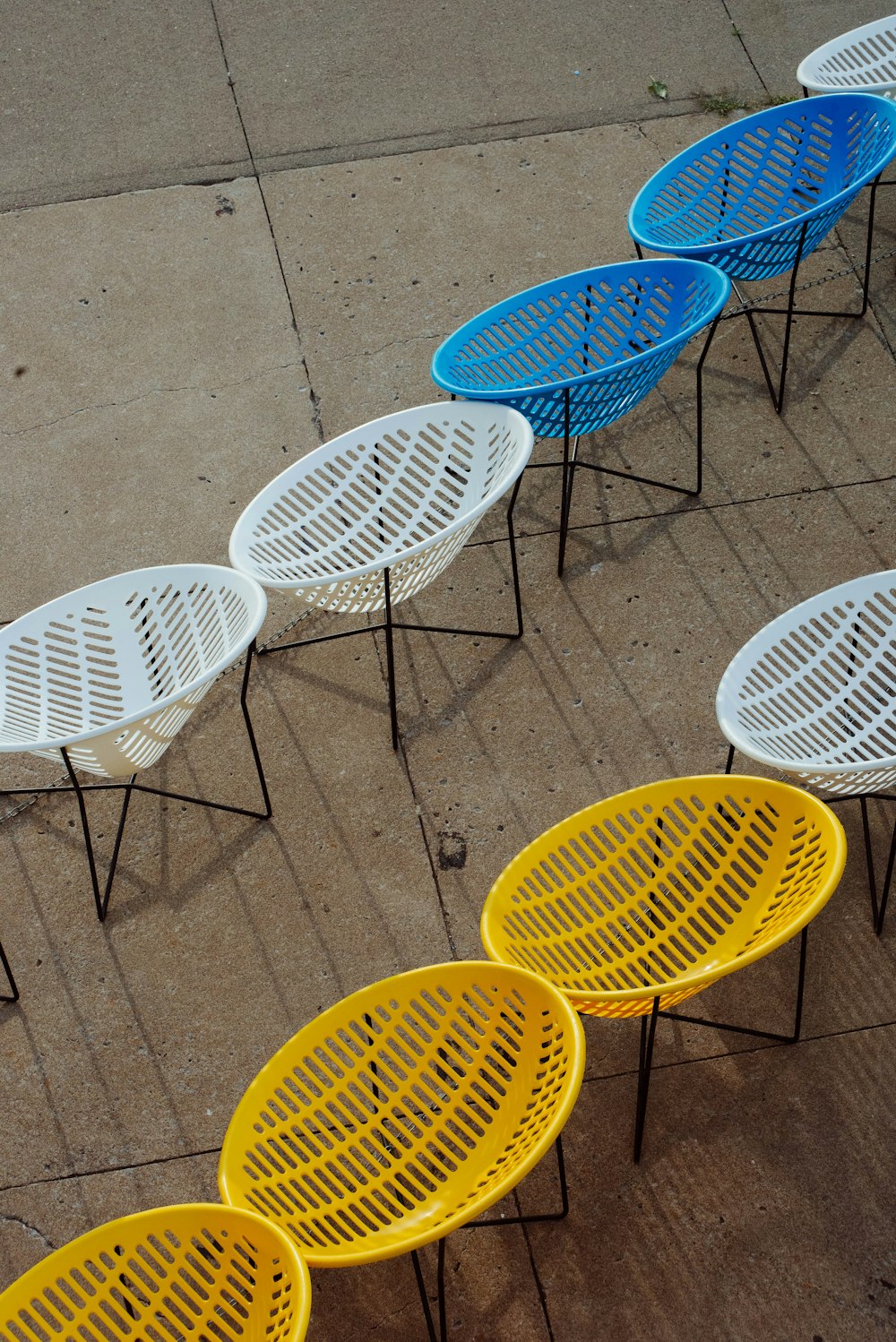 top view of empty accent chairs on pavement