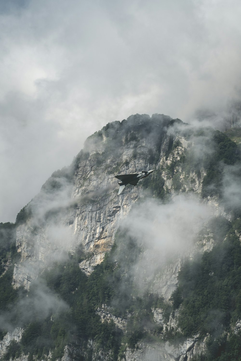 gray rock mountain under white clouds