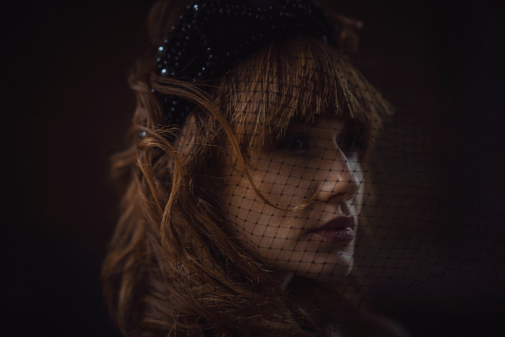 woman wearing black mesh veil