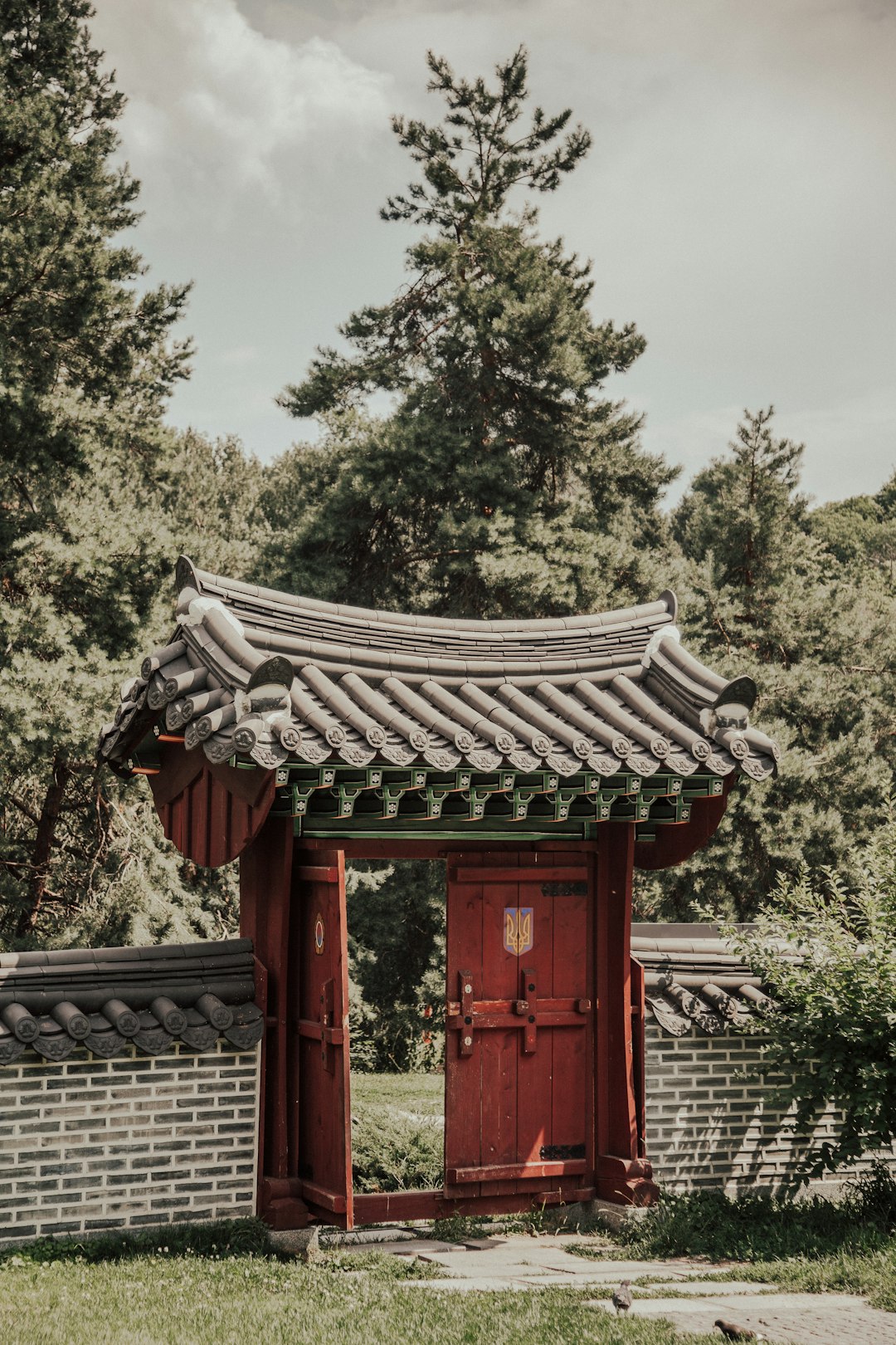 opened red wooden gate during daytime