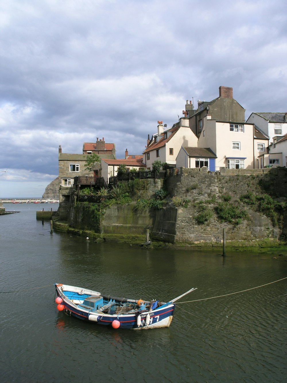 boat near island with houses