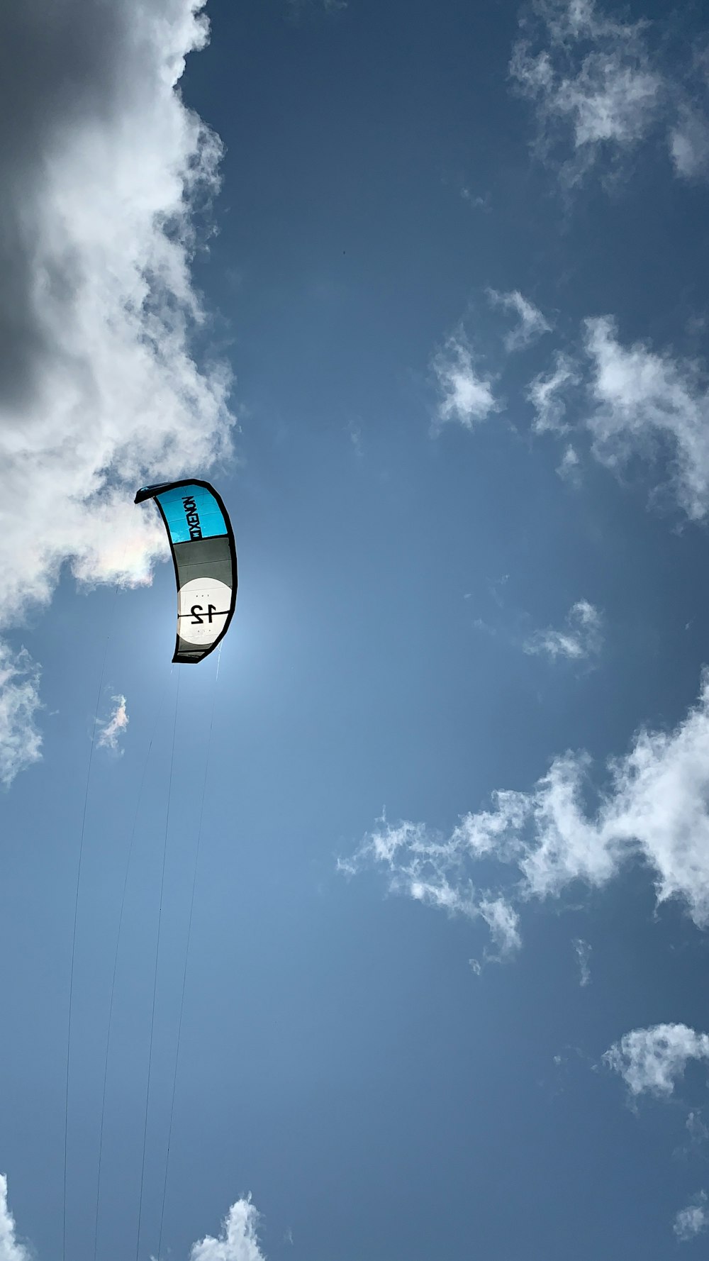 low angle photo of parachute during daytime