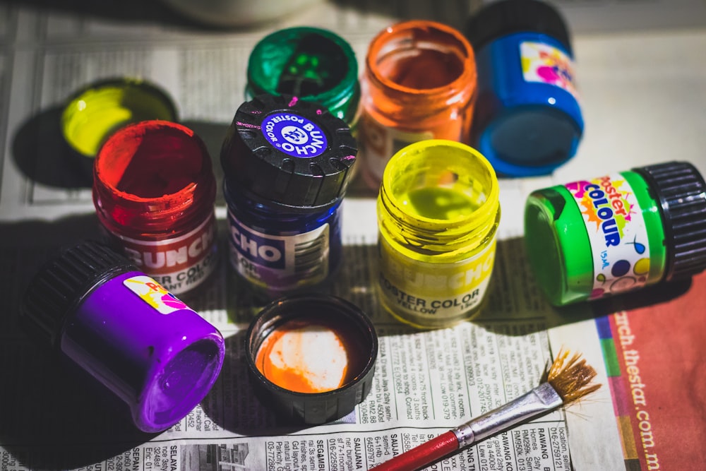 assorted-color paint containers