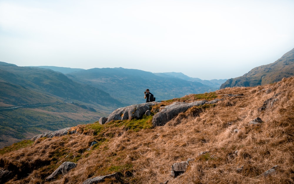 person standing on high ground during daytime