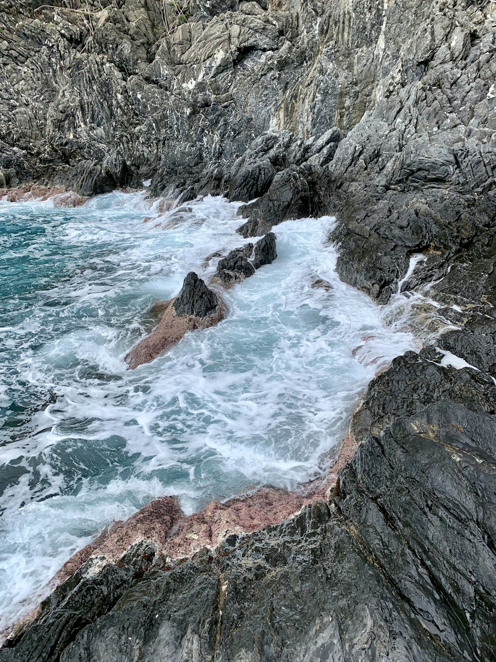 rock formations near body of water during daytime