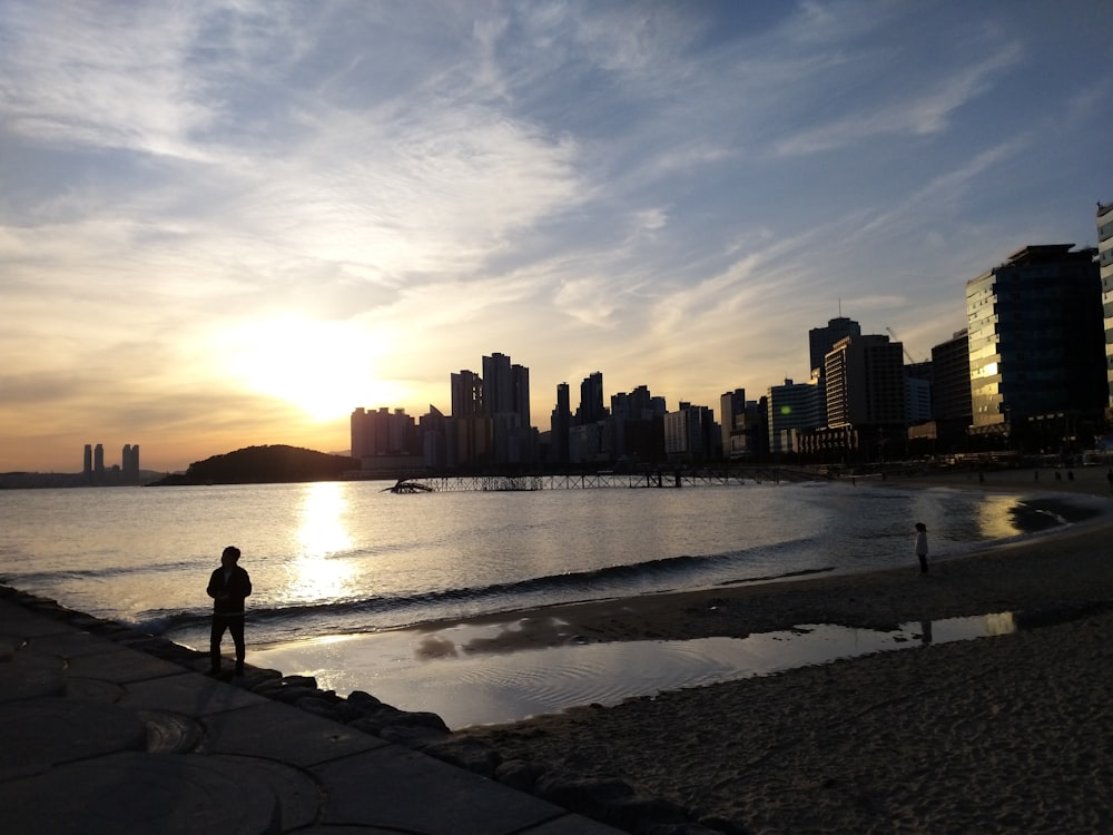 city and sea during golden hour