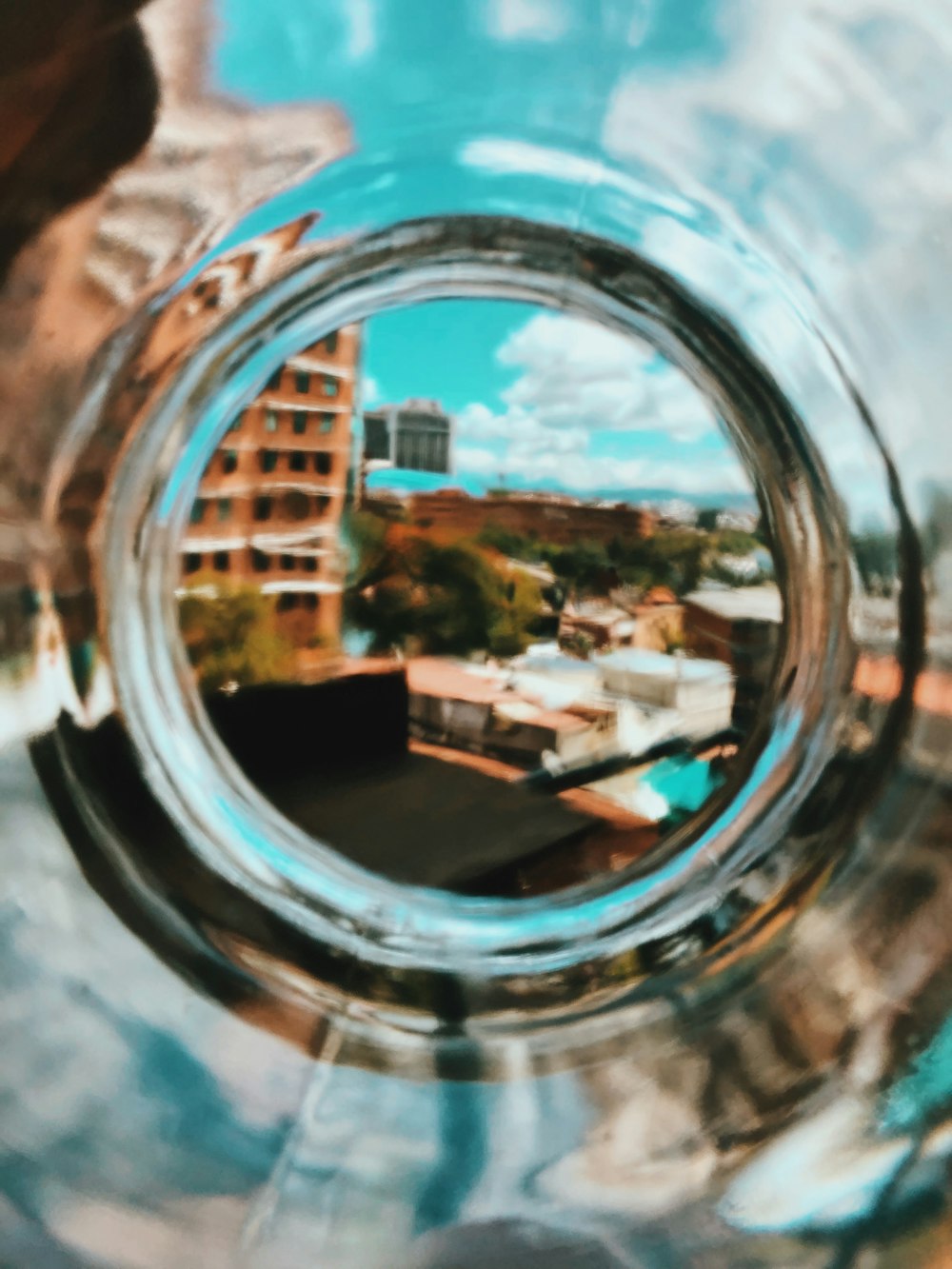 a view of a city through a glass