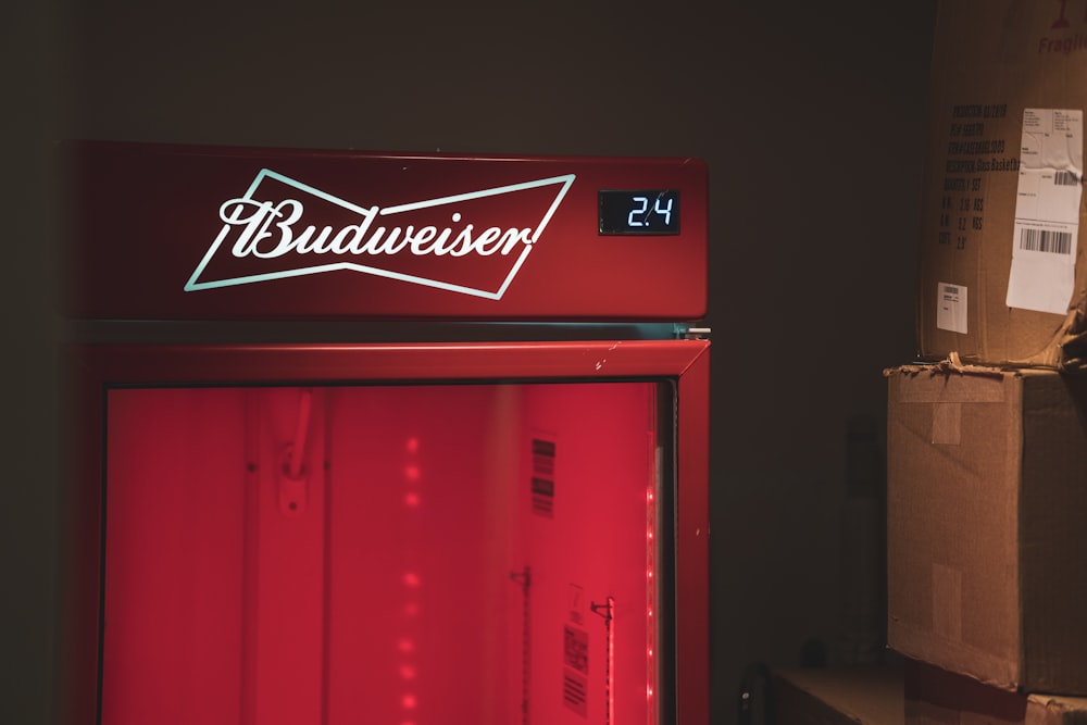 closed red Budweiser refrigerator