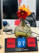 An office desk with a calendar marked with upcoming job application deadlines.