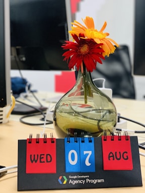 A welcoming office space with a desk, phone, and calendar filled with event dates.