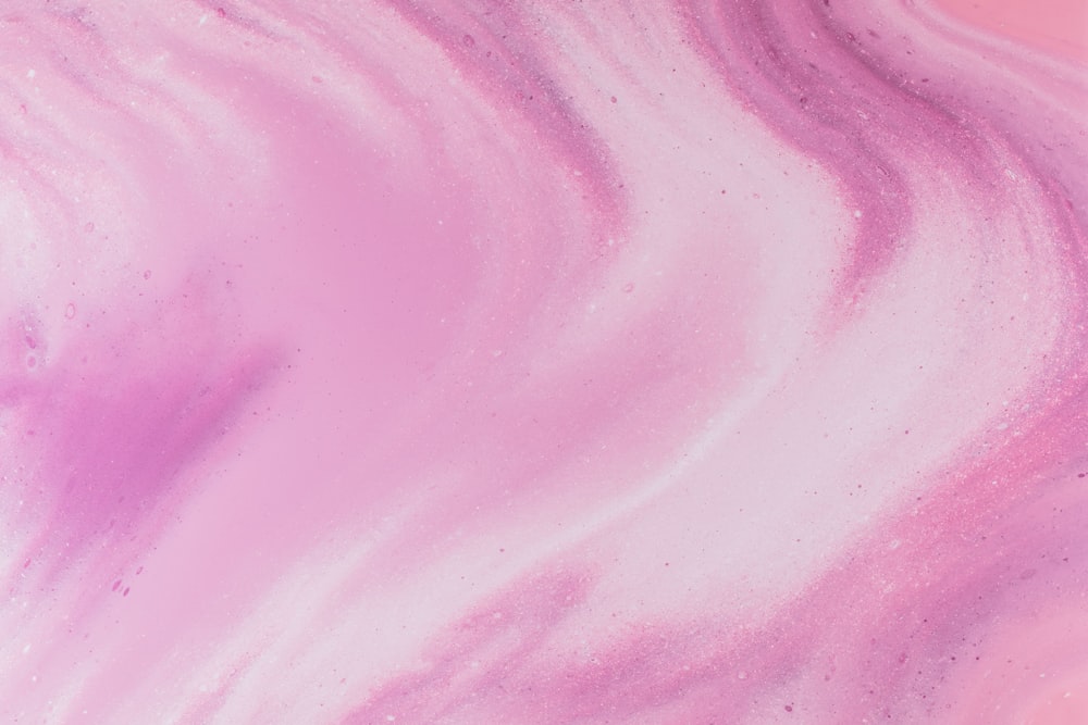 a close up of a pink and purple substance