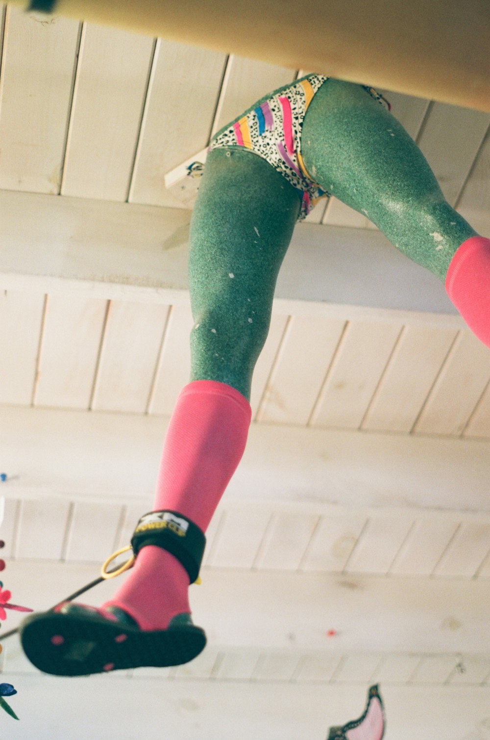 a pair of feet hanging from a ceiling