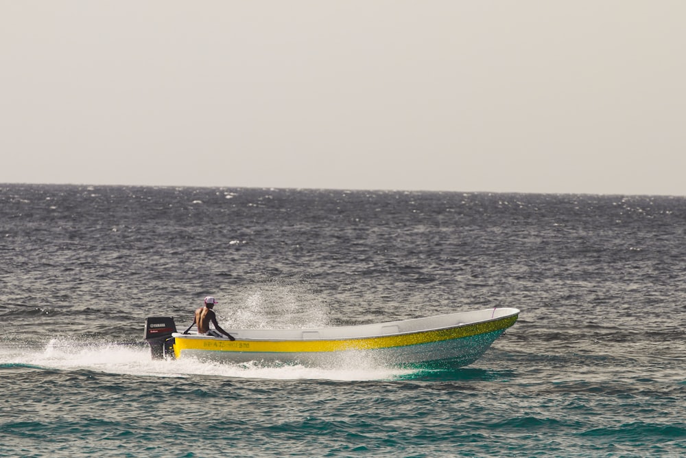 man riding powerboat in ocean