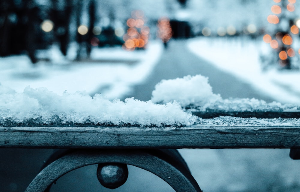 snow covered railings