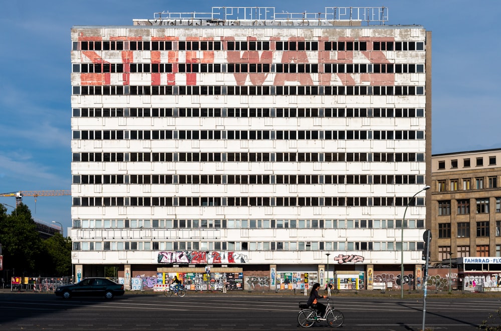 white and red concrete high-rise building during daytime